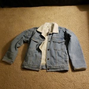 Jean jacket with fuzz on the inside.